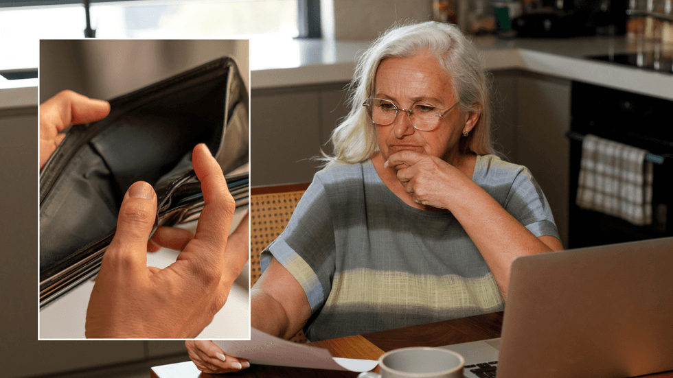 Woman looking at finances and empty purse
