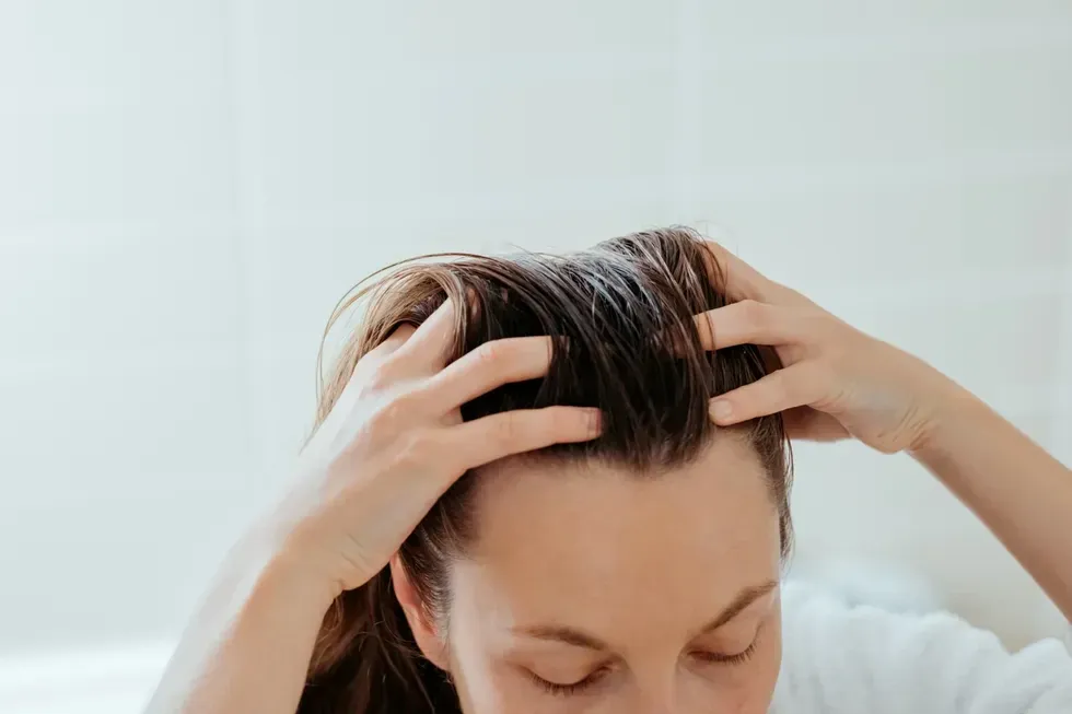 Woman massaging scalp 