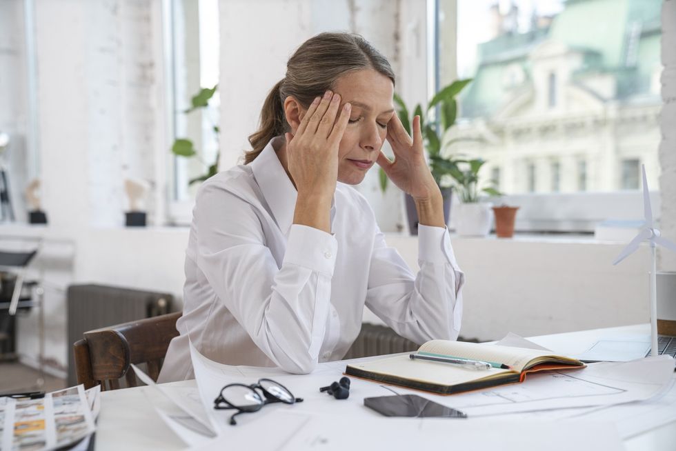 Woman stressing at her desk