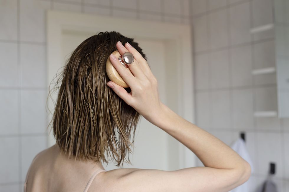 Woman treating scalp