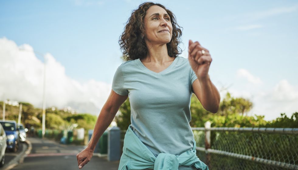 Woman walking and swinging her arms