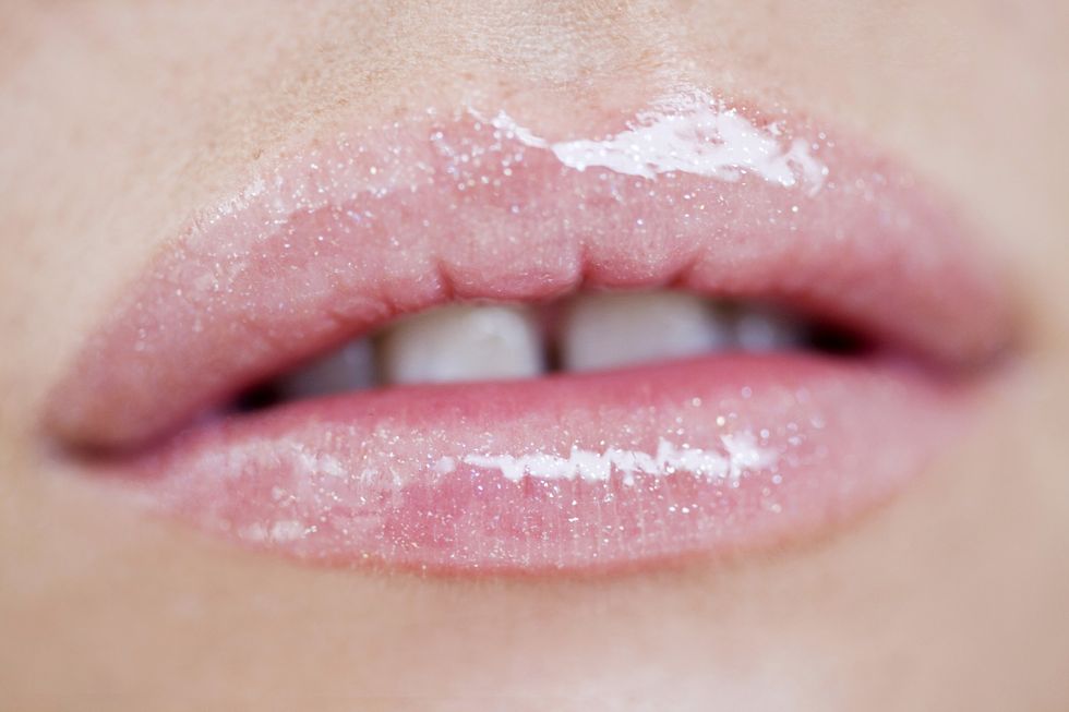 Woman wearing lip gloss
