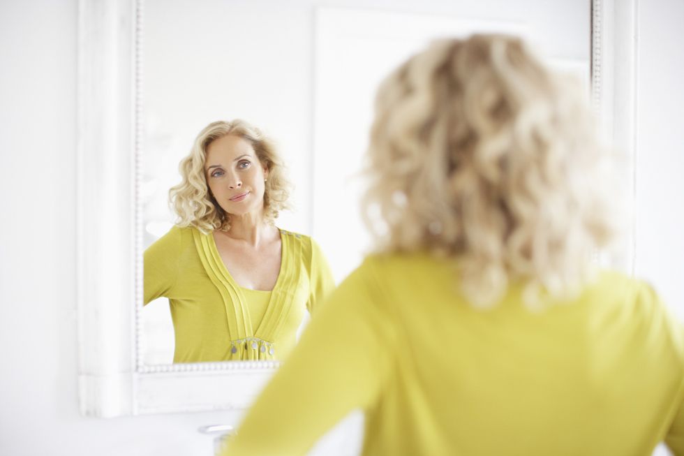 Woman with blonde, curly hair
