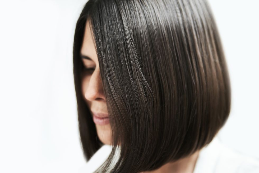 Woman with dark brown bob haircut