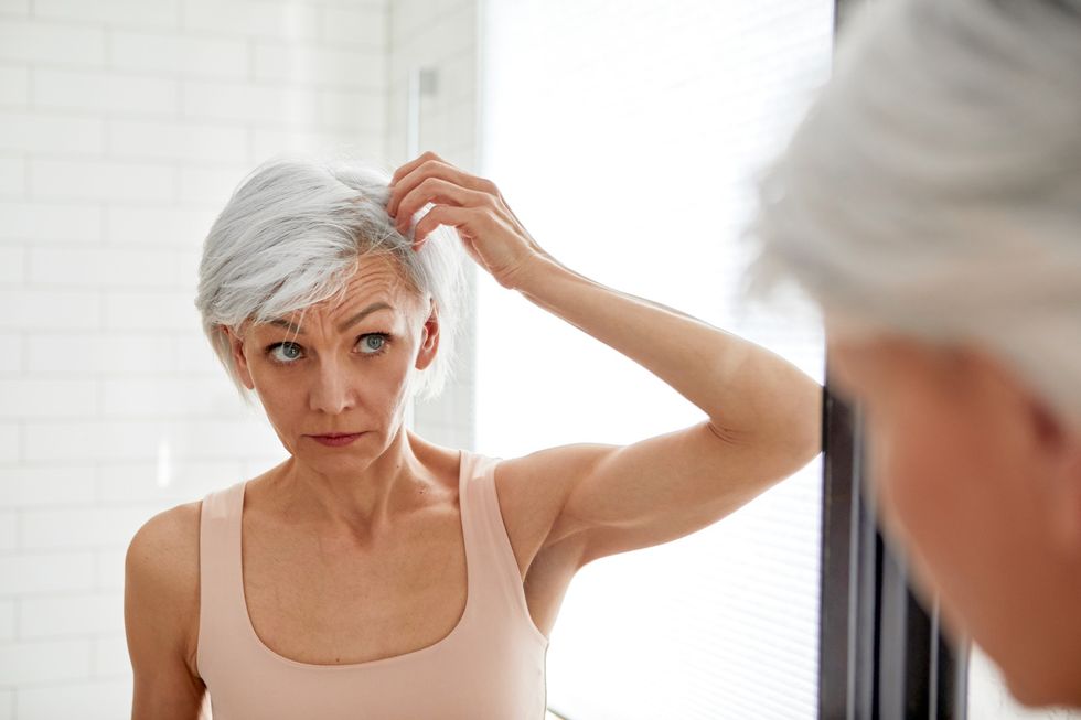 Woman with grey pixie cut