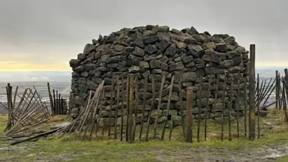 Wooden fence around one of the cairns