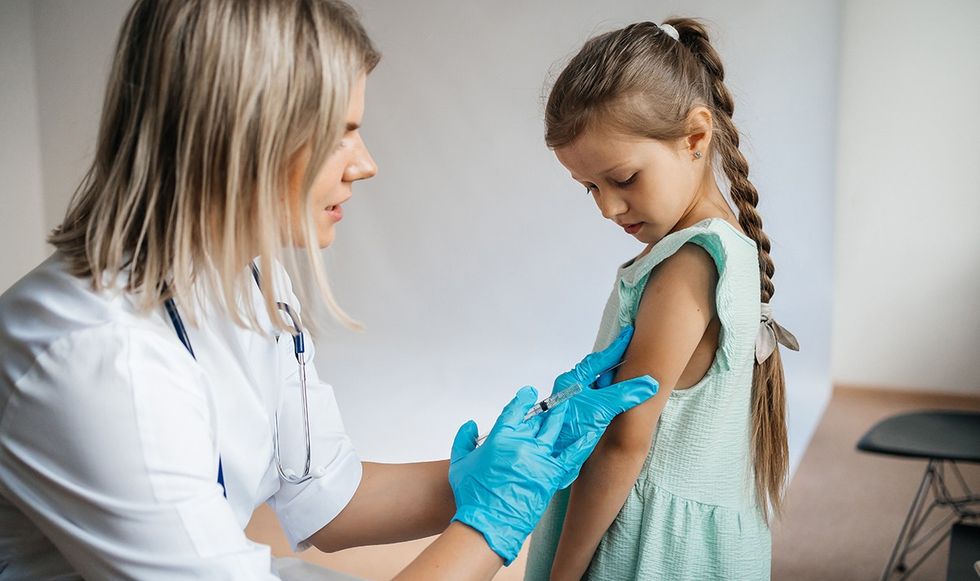 Young child getting vaccinated