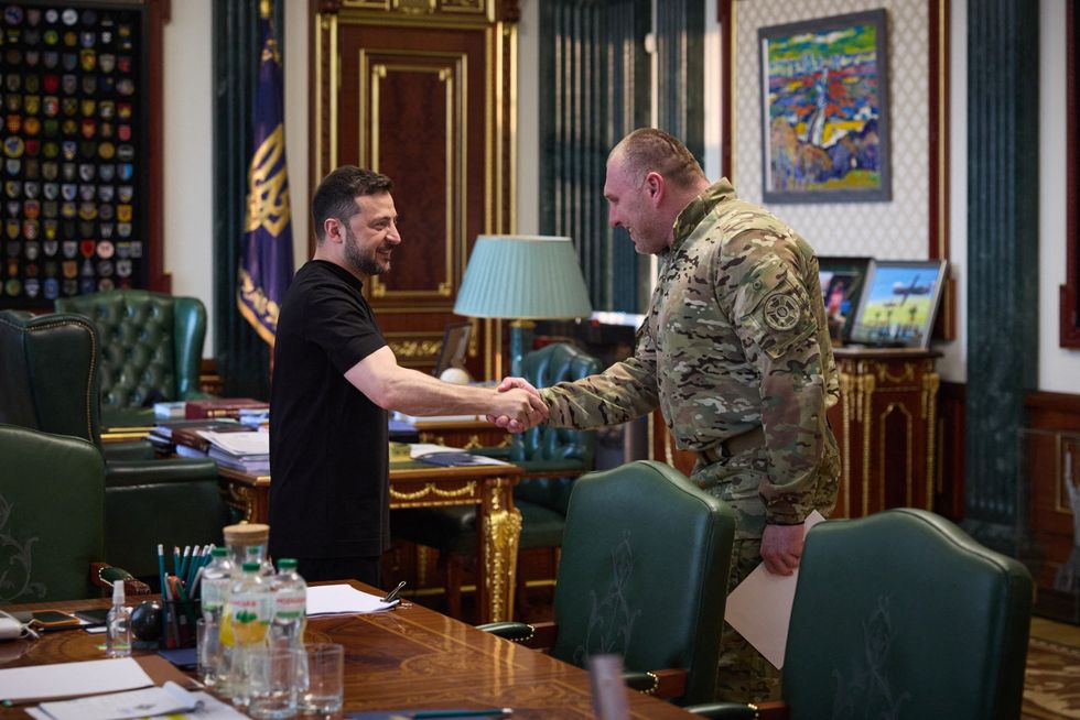 Zelensky and Maliuk shake hands